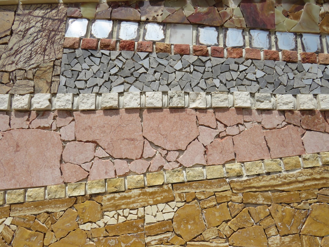 Detailed close-up shot of old, cracked, and curling asphalt roof shingles, indicating the need for replacement and repair.